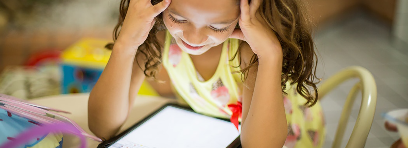 Girl reading on a tablet Girl reading on a tablet