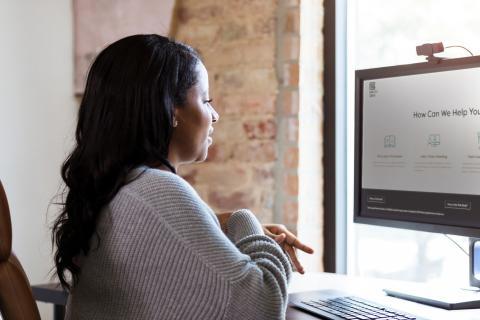Woman sitting at a desktop computer