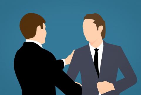 two people shaking hands