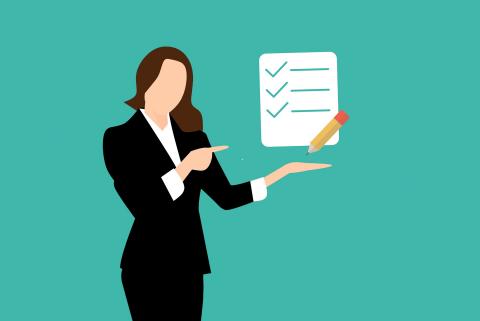 person holding checklist