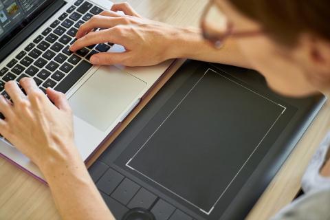woman typing on computer