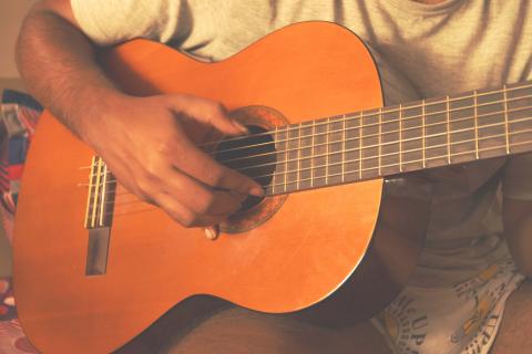 person playing guitar