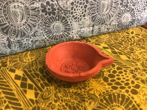 unpainted terracotta oil lamp