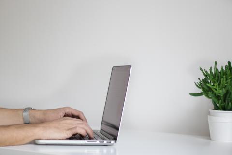 person using their laptop
