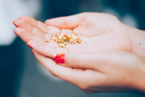 hands holding glitter