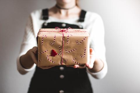 person holding wrapped present