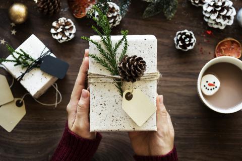 wrapped gift with pinecones