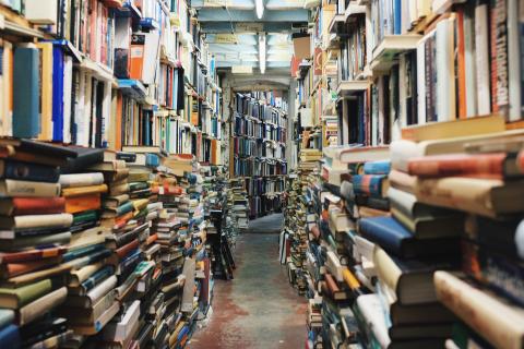 books piled on each side to make a path