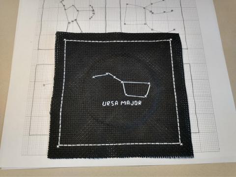Ursa Major constellation depicted in cross-stitch embroidery