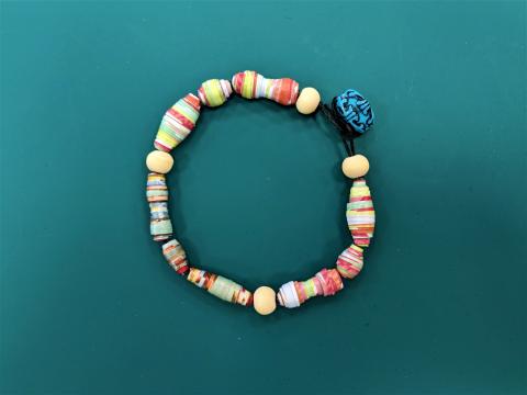 bracelet made with paper, wood, and polymer beads