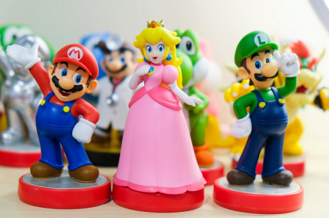 photo of amiibos (small figurines) of Mario, Princess Peach, and Luigi