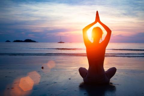 yoga pose at beach