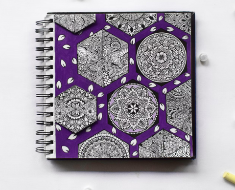 photo of a notebook covered in zentagle designs