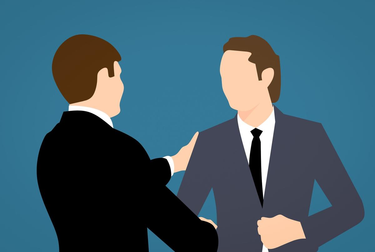 two people shaking hands
