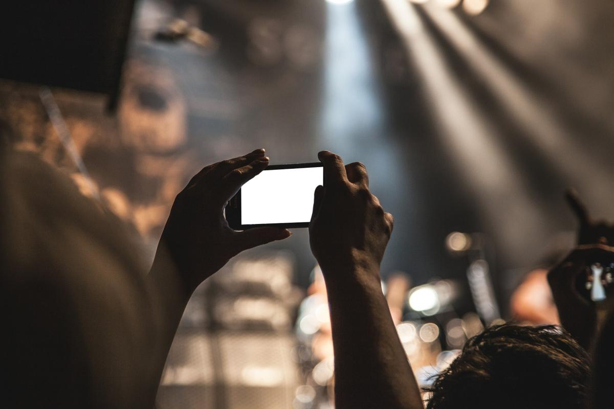 person taking video with smartphone