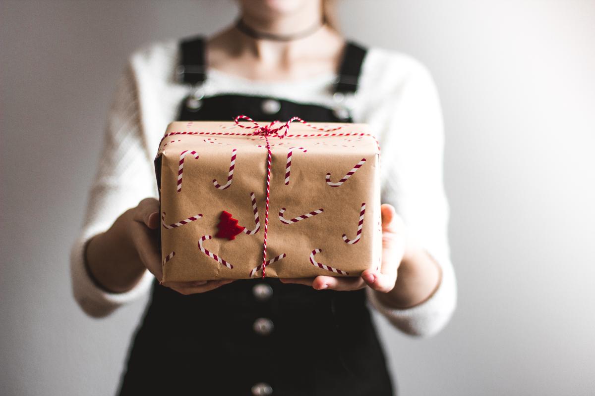 person holding wrapped present