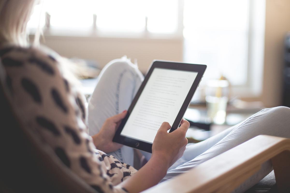 person hlding ereader