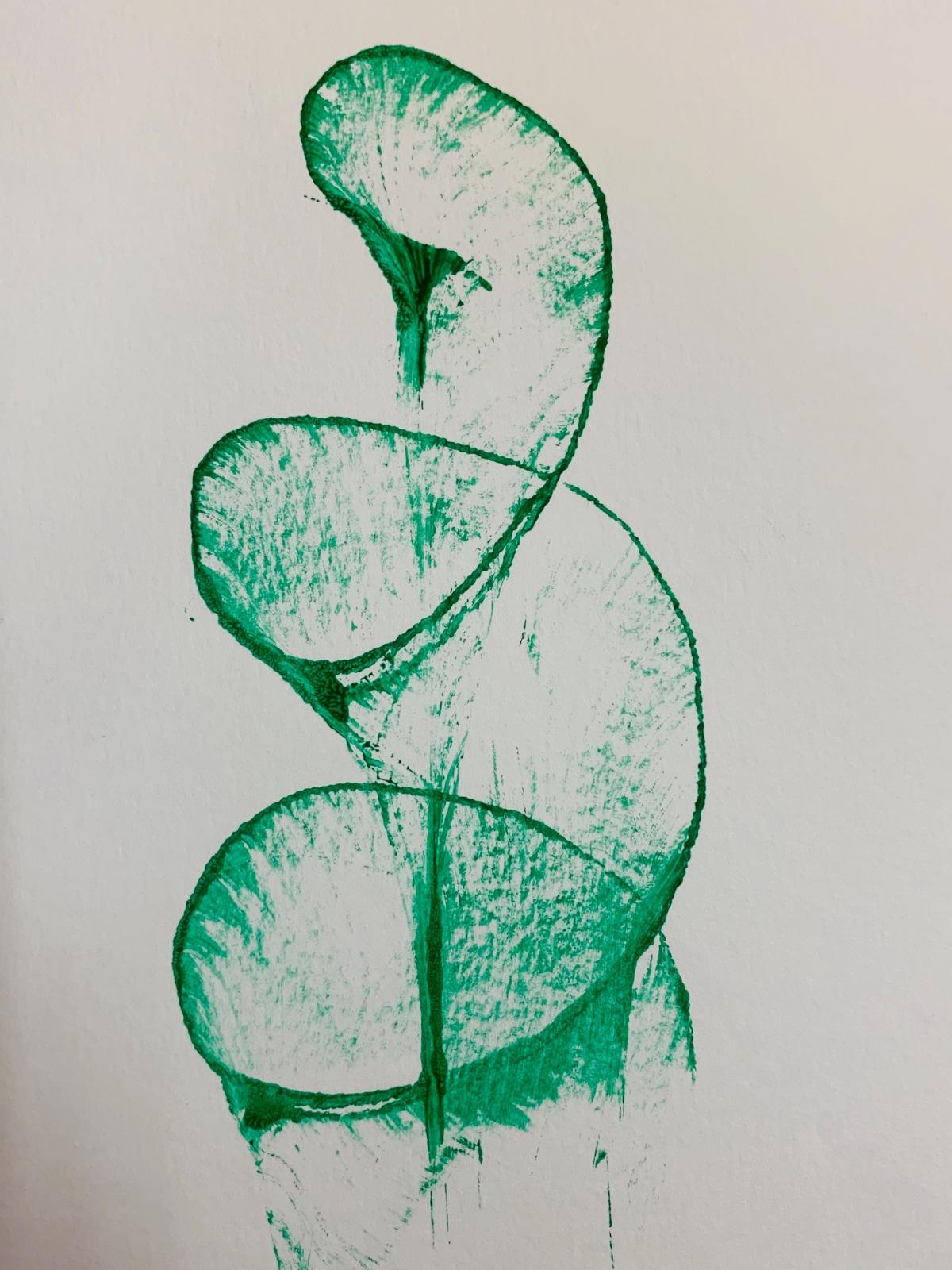 green spiral on white paper