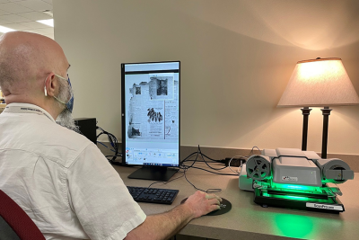 Manager Daniel Sample using the ScanPro at a desk