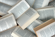 Stack of open books in a pile