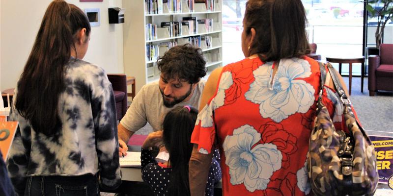 Author signing book