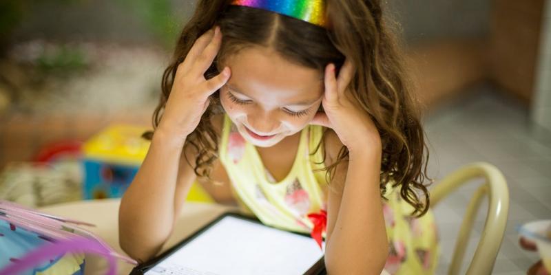 Girl reading on a tablet