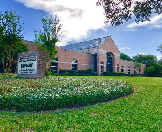 Exterior of First Colony Branch Library, with library sign.
