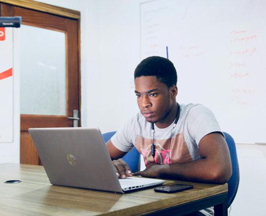 Teen male on a laptop