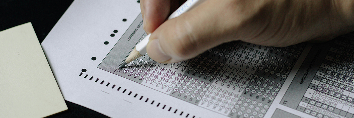 Person filling in bubbles on a standardized test